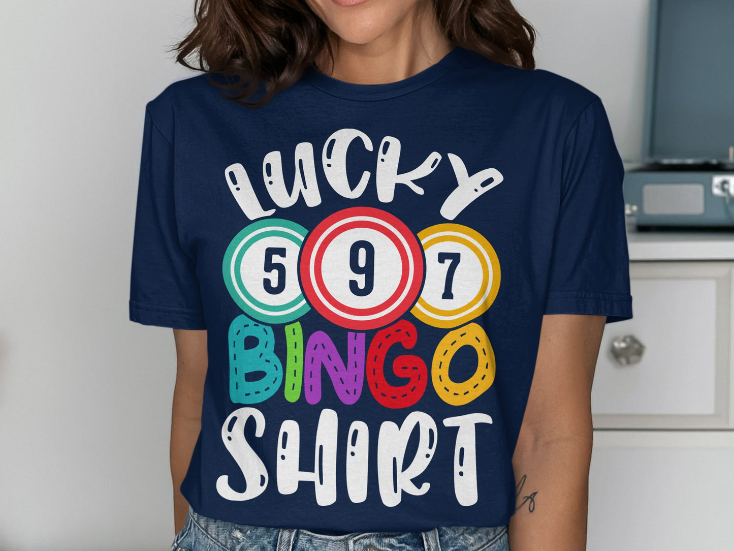 Navy t-shirt with "LUCKY BINGO SHIRT" text and colorful bingo balls.