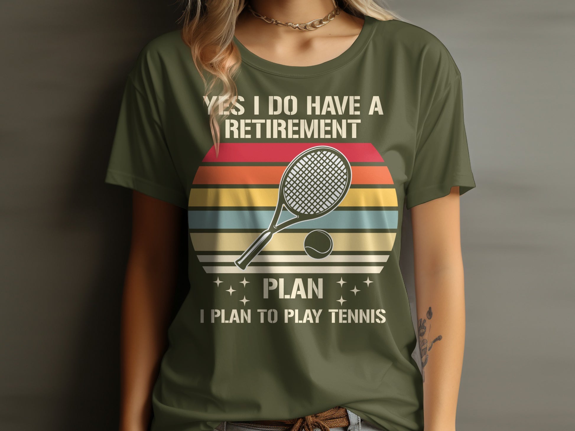 Olive green t-shirt with "YES I DO HAVE A RETIREMENT PLAN I PLAN TO PLAY TENNIS" and tennis imagery.
