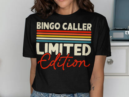 Black t-shirt with "BINGO CALLER LIMITED EDITION" in colorful stripes and red script.