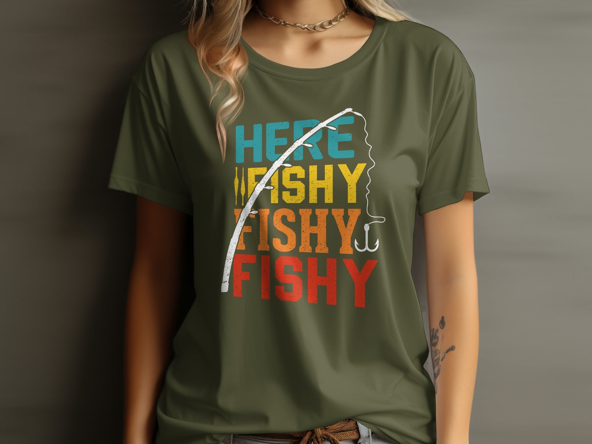 Green t-shirt with "HERE FISHY FISHY" text and fishing rod graphic.