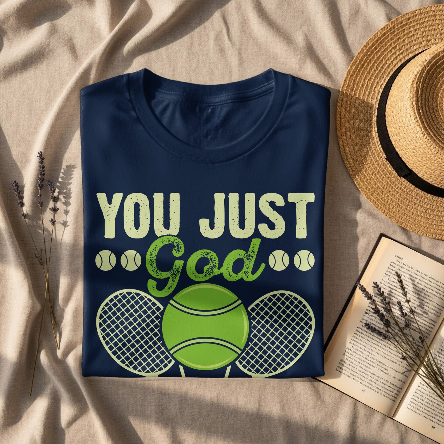 Navy t-shirt with "YOU JUST God" and tennis graphic.