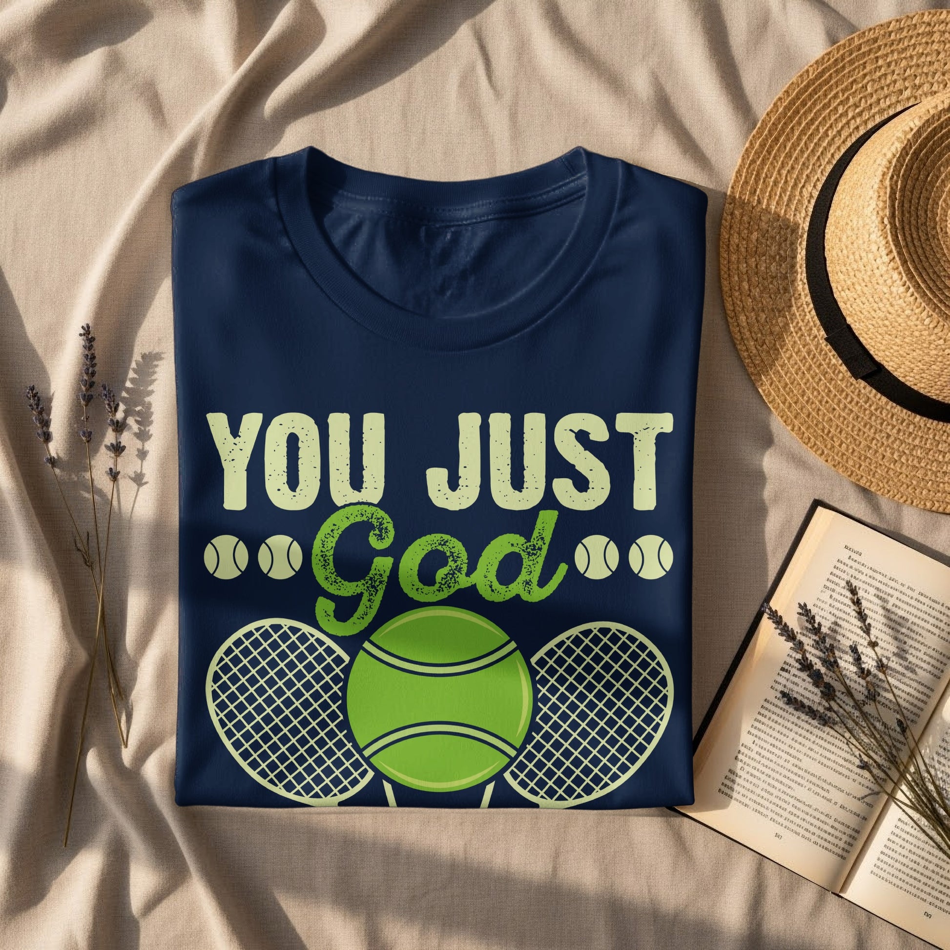 Navy t-shirt with "YOU JUST God" and tennis graphic.