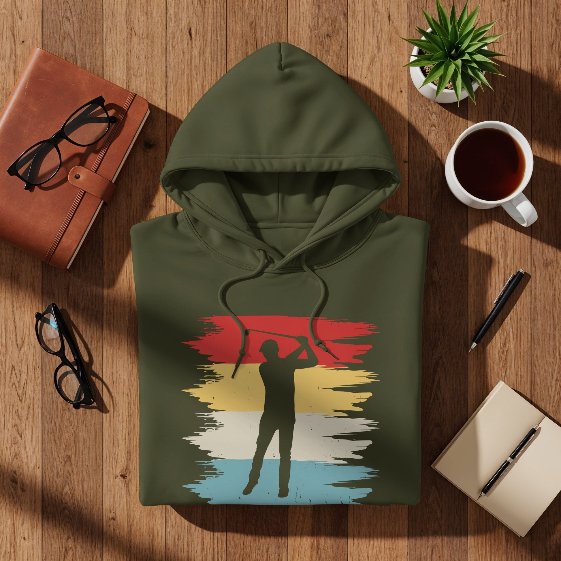 Green hoodie with a vintage golfer graphic.