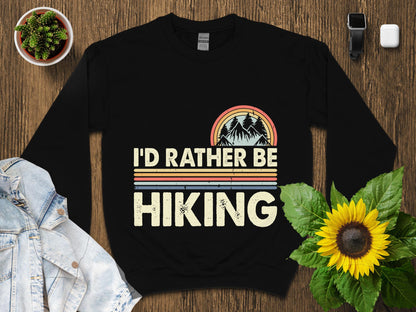 Black sweatshirt with "I'd Rather Be Hiking" text and mountain graphic.