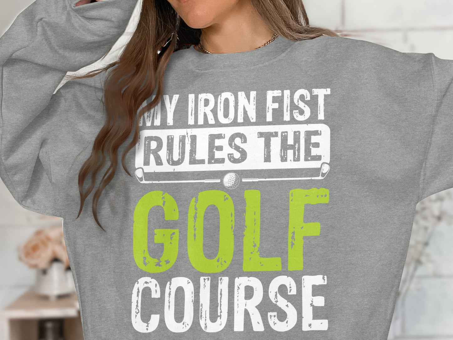 Grey sweatshirt with "MY IRON FIST RULES THE GOLF COURSE" text and golf graphic.