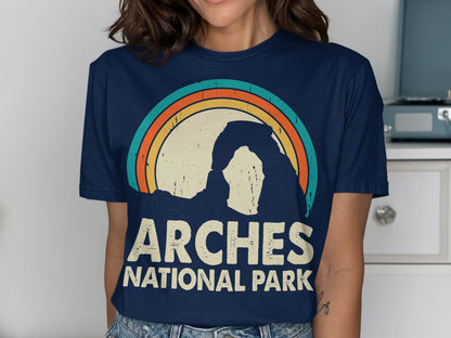 Archways National Park sunset graphic on a navy blue t-shirt.
