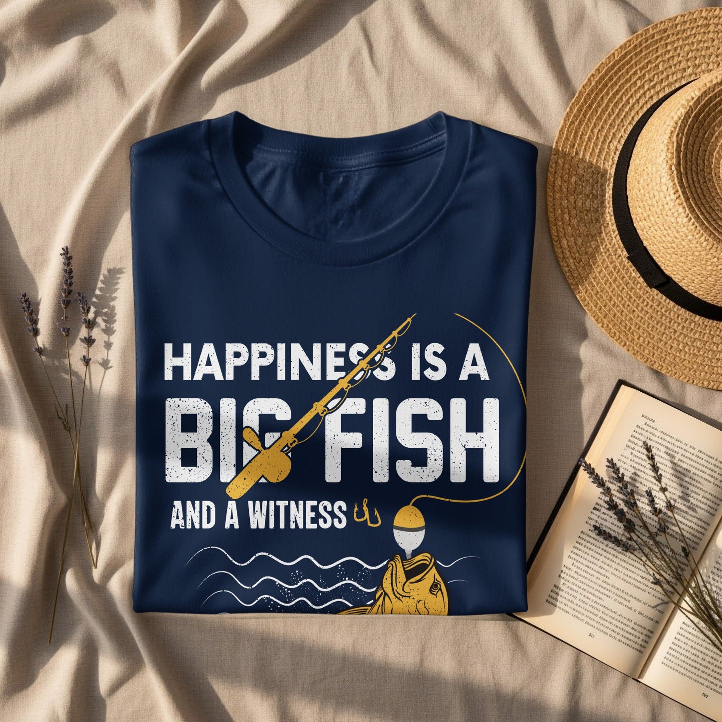 Navy t-shirt with "Happiness is a Big Fish and a Witness" fishing graphic.