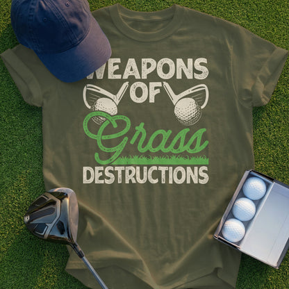Olive green t-shirt with "Weapons of Grass Destructions" text and golf imagery.