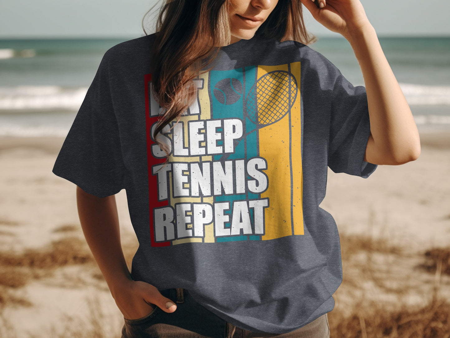 "Let sleep tennis repeat" text on t-shirt with tennis racket and ball graphic.