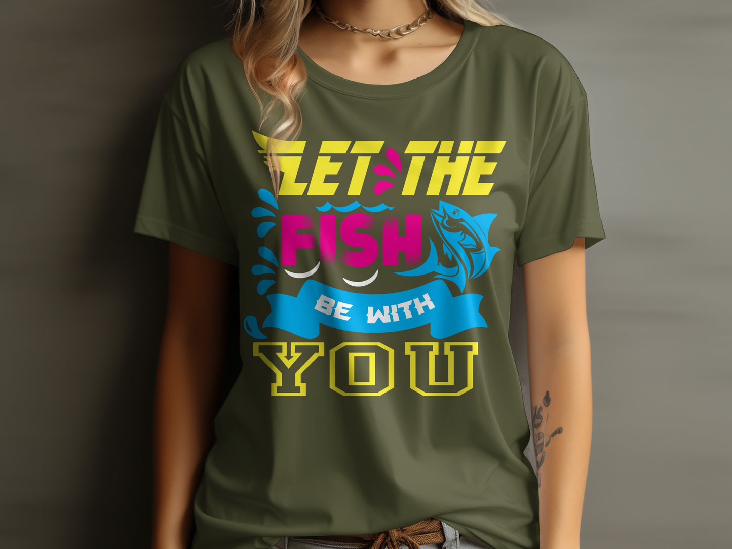 Olive green t-shirt with yellow and pink text and a blue fish graphic.