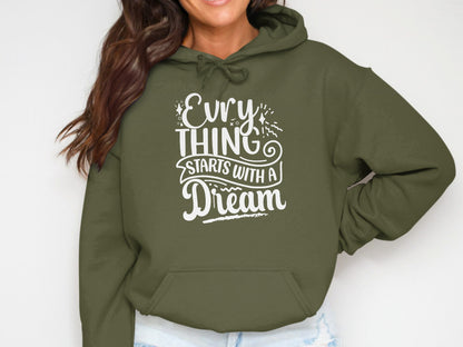 Olive green hoodie with white text "Evry thing starts with a Dream".