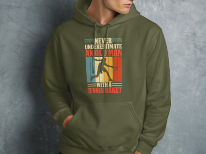 Green hoodie with "Never underestimate an old man with a tennis racket" text and graphic.