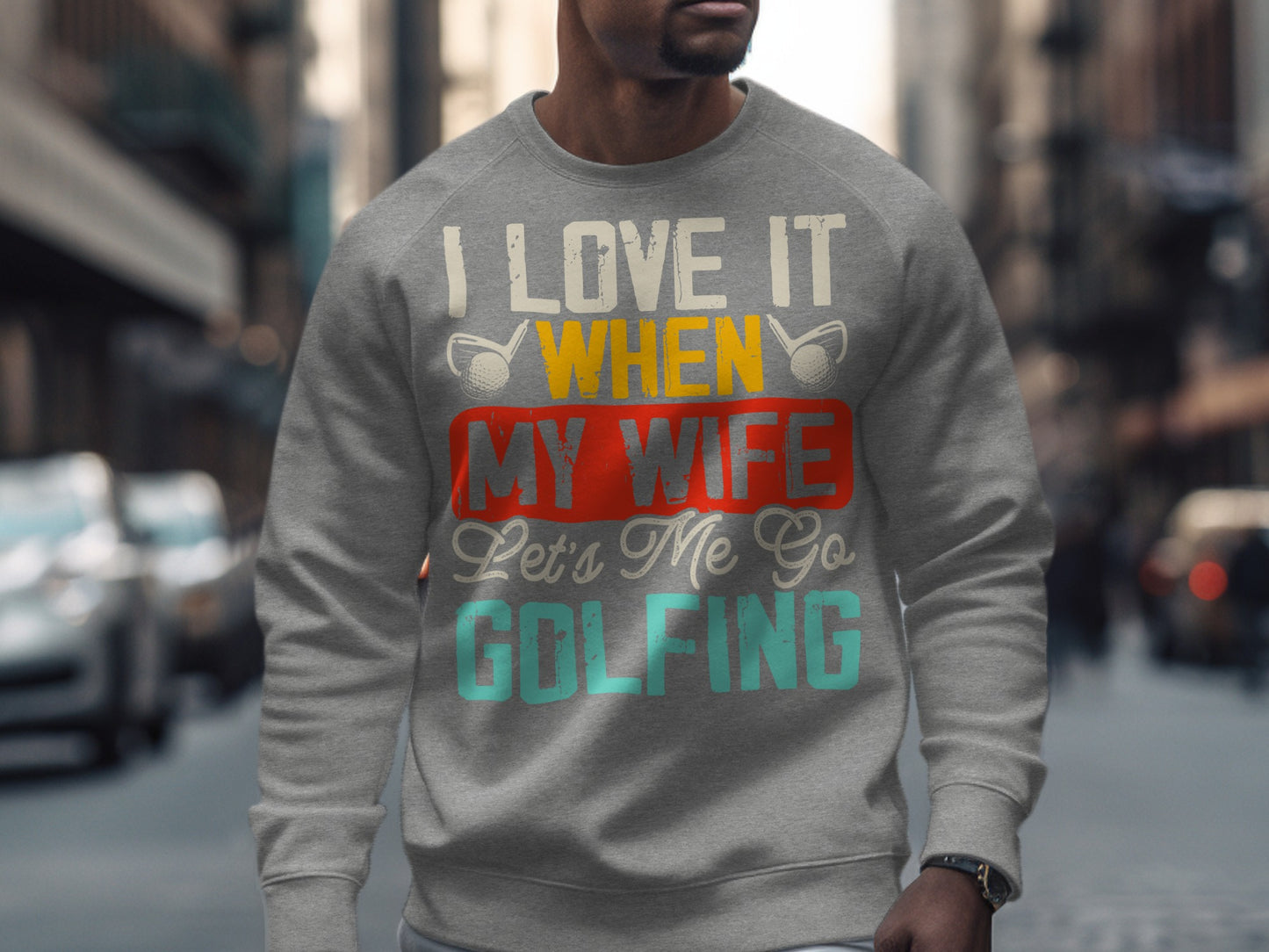 Gray sweatshirt with "I love it when my wife lets me go golfing" text.