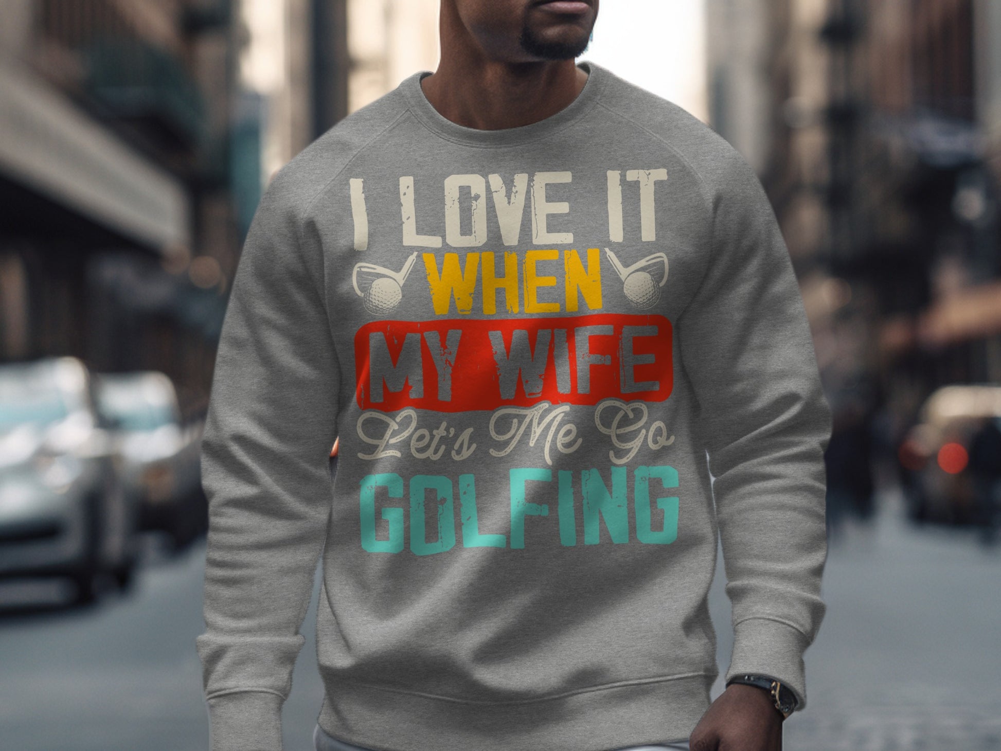 Gray sweatshirt with "I love it when my wife lets me go golfing" text.