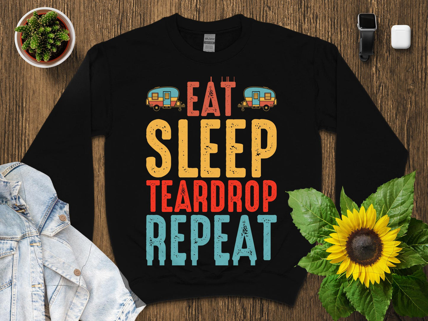 Black sweatshirt with "Eat Sleep Teardrop Repeat" text and camping graphics.