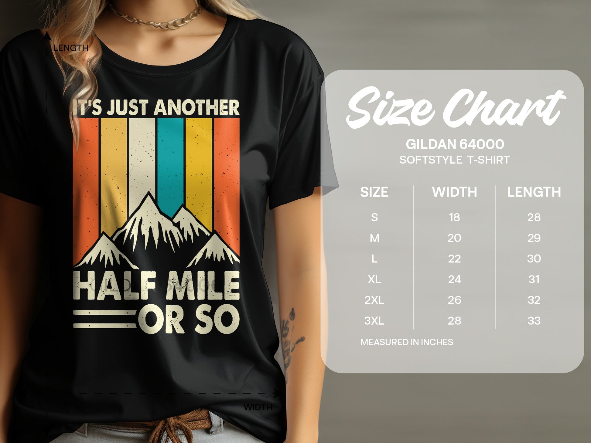 T-shirt with mountain graphic and "IT'S JUST ANOTHER HALF MILE OR SO" text, alongside a size chart.