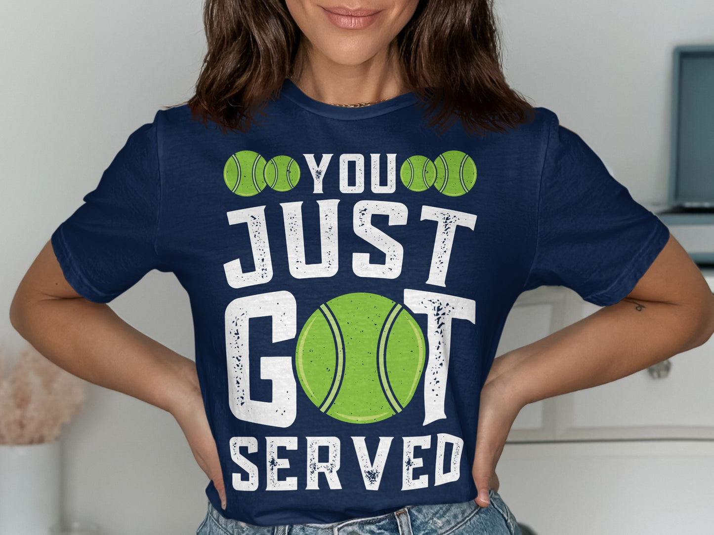 Navy t-shirt with "YOU JUST SERVED" and tennis ball graphics.