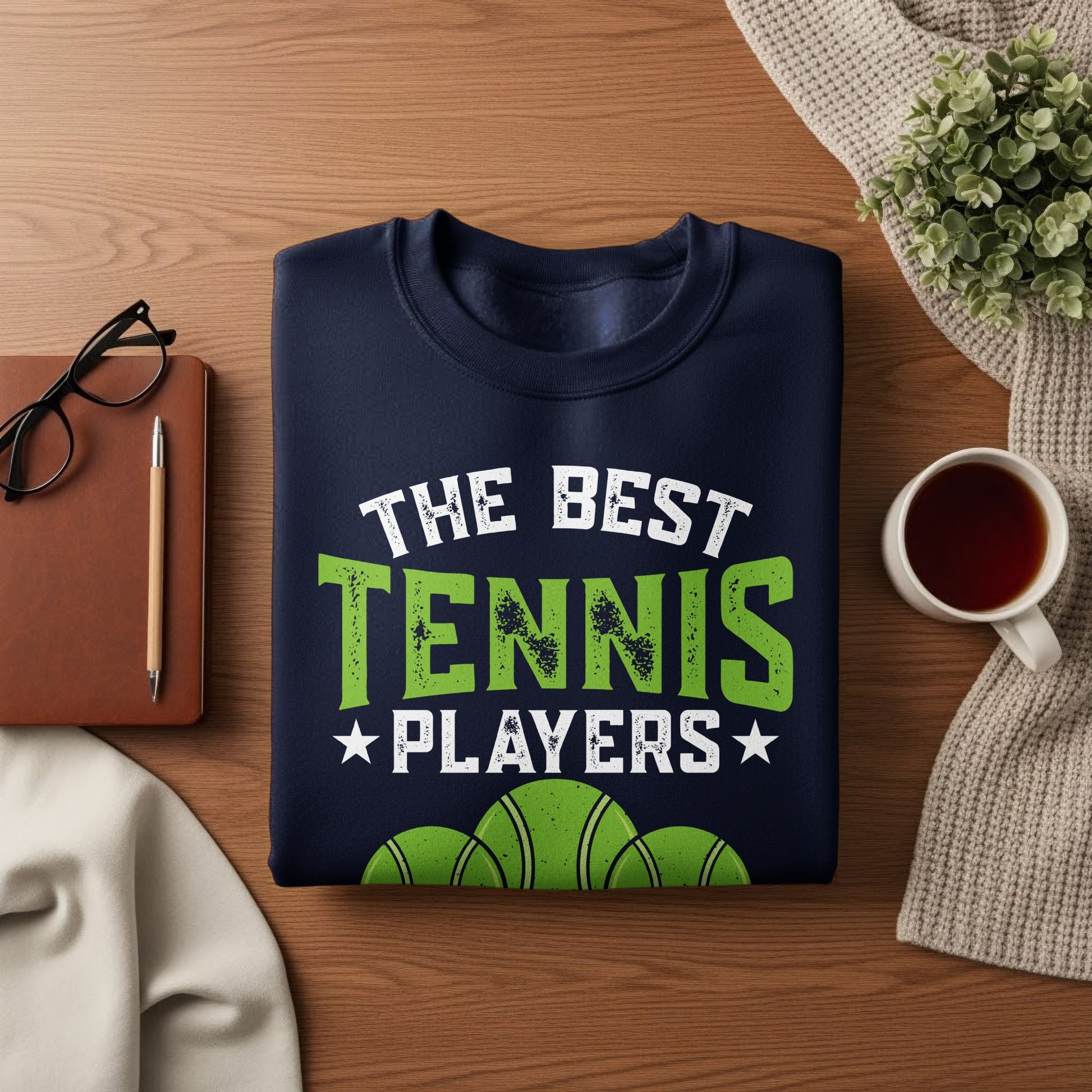 Navy sweatshirt with "The Best Tennis Players" and tennis balls graphic.