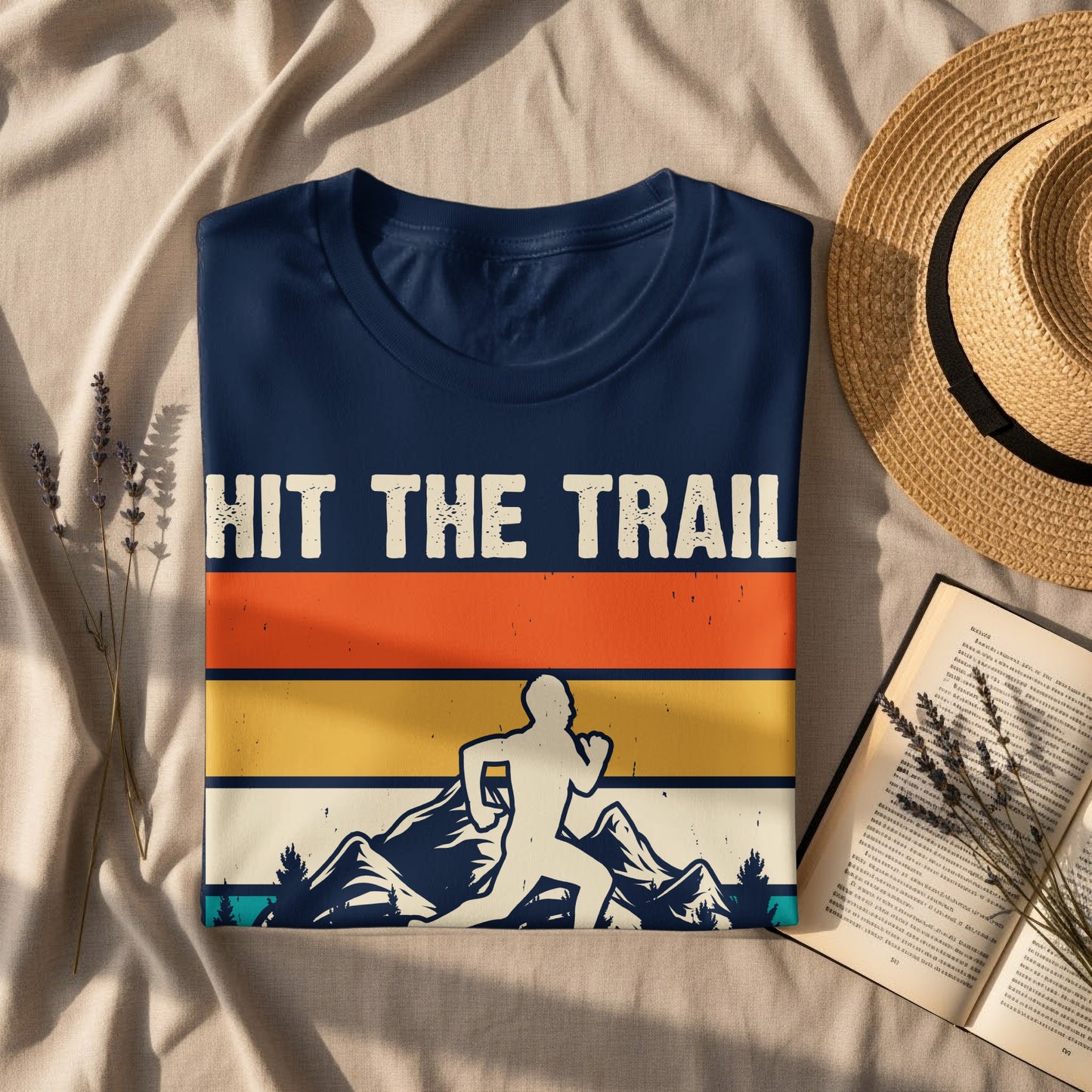 Navy t-shirt with "HIT THE TRAIL" in retro stripes over a running silhouette.
