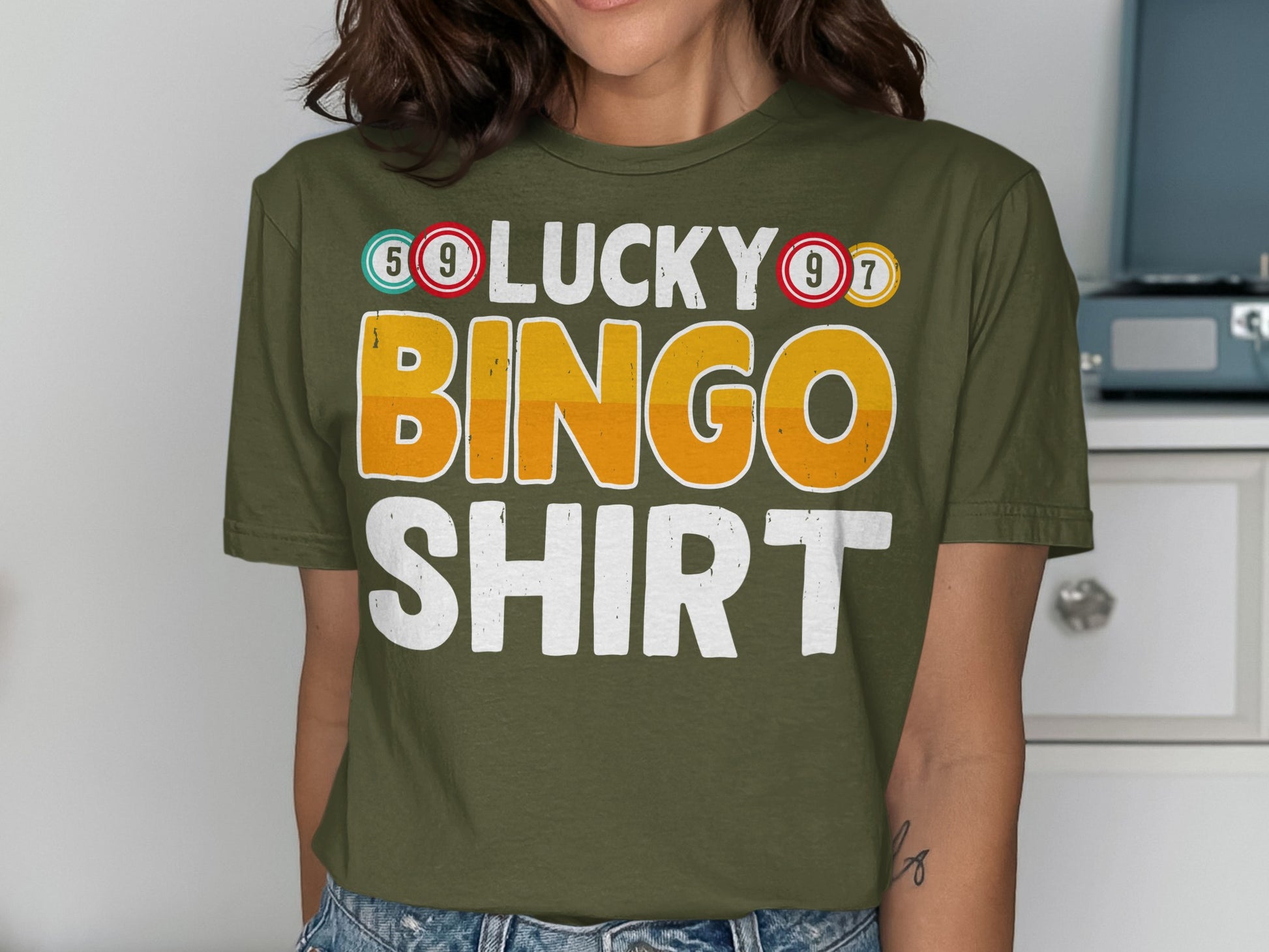 Green t-shirt with "Lucky Bingo Shirt" text and bingo numbers.