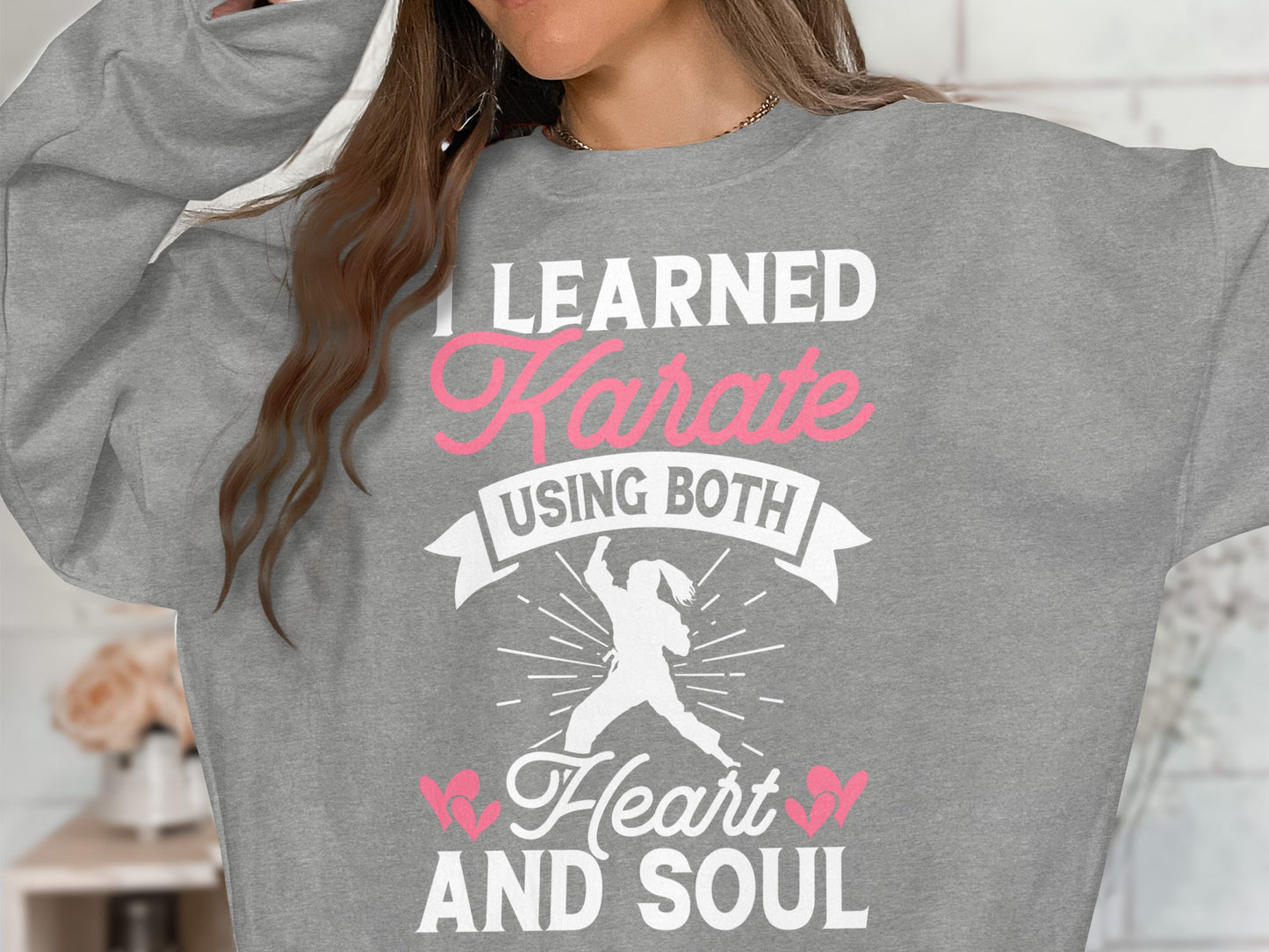 Gray sweatshirt with "I Learned Karate Using Both Heart And Soul" text.
