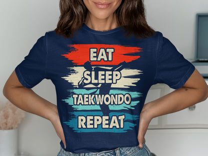 Navy t-shirt with "EAT SLEEP TAEKWONDO REPEAT" text and a taekwondo silhouette.