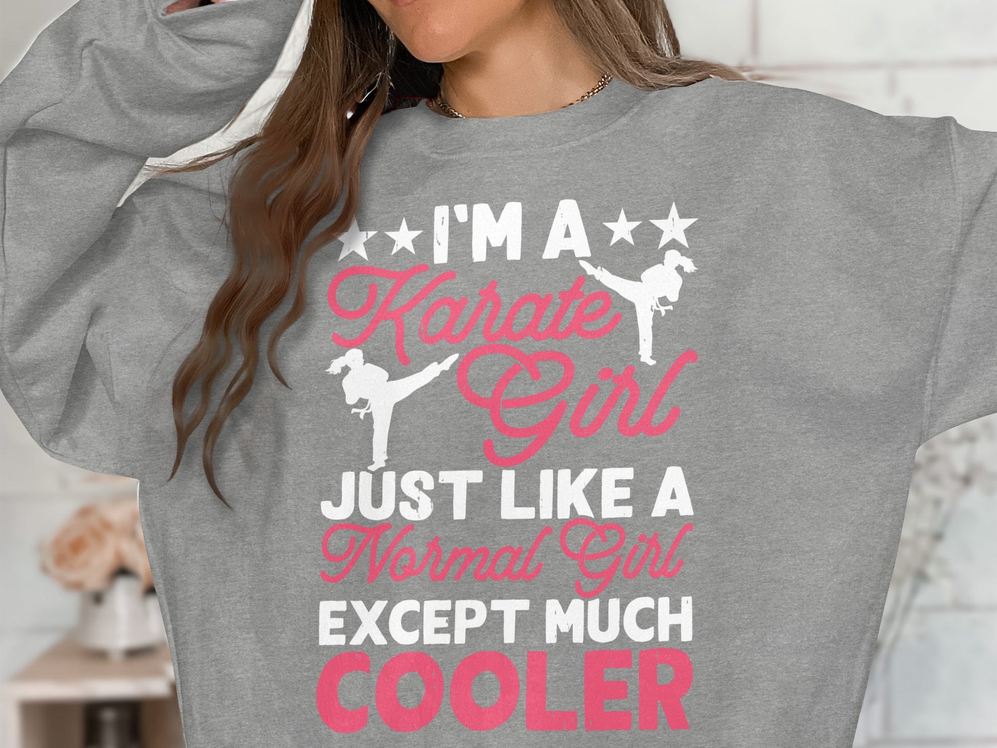 Grey sweatshirt with "I'm a Karate Girl Just Like a Normal Girl Except Much Cooler" text.
