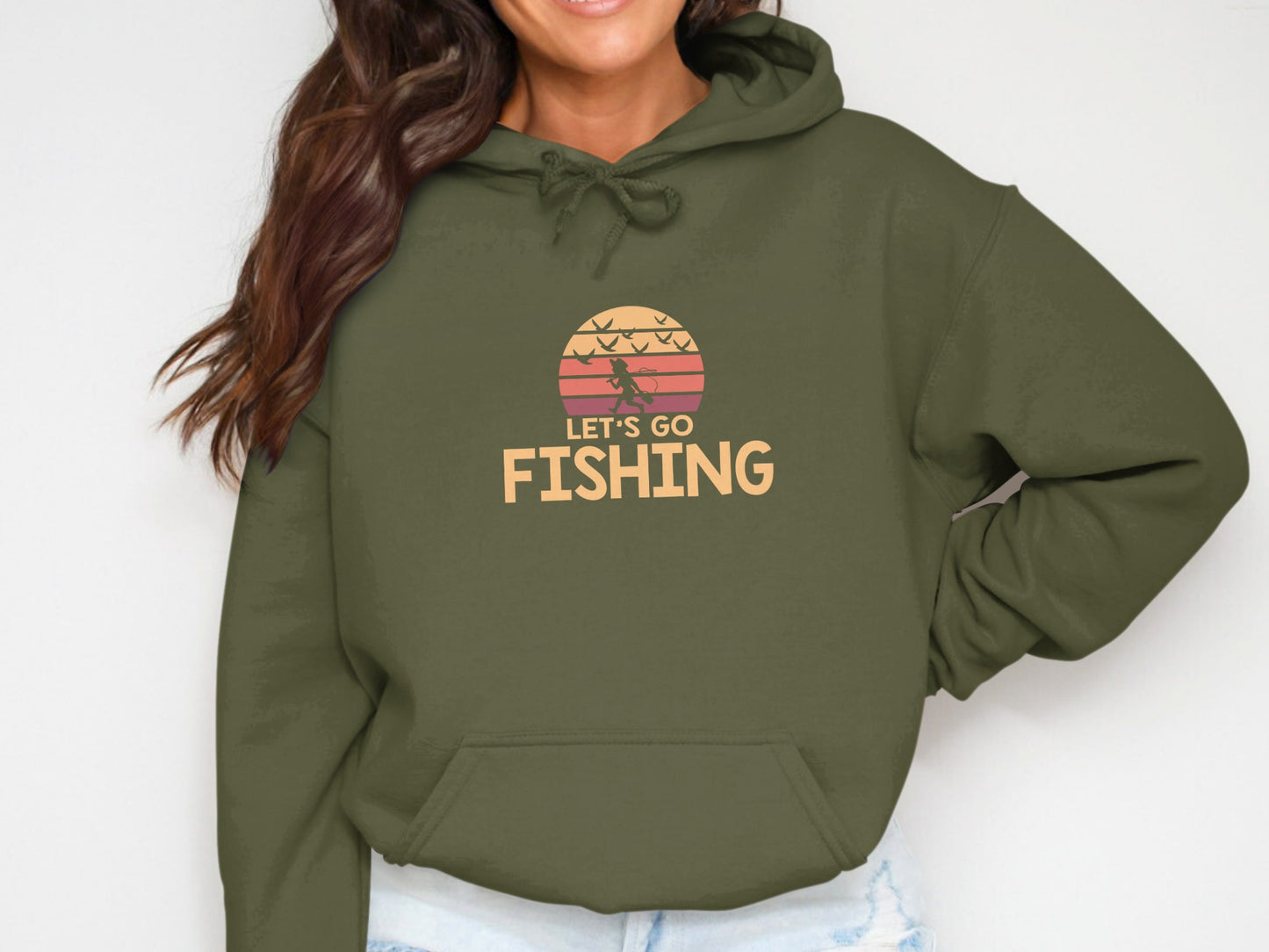 Olive green hoodie with "Let's Go Fishing" graphic and sunset motif.