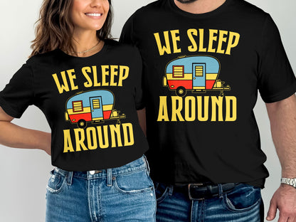 Couple wearing matching "We Sleep Around" t-shirts with RV graphic.