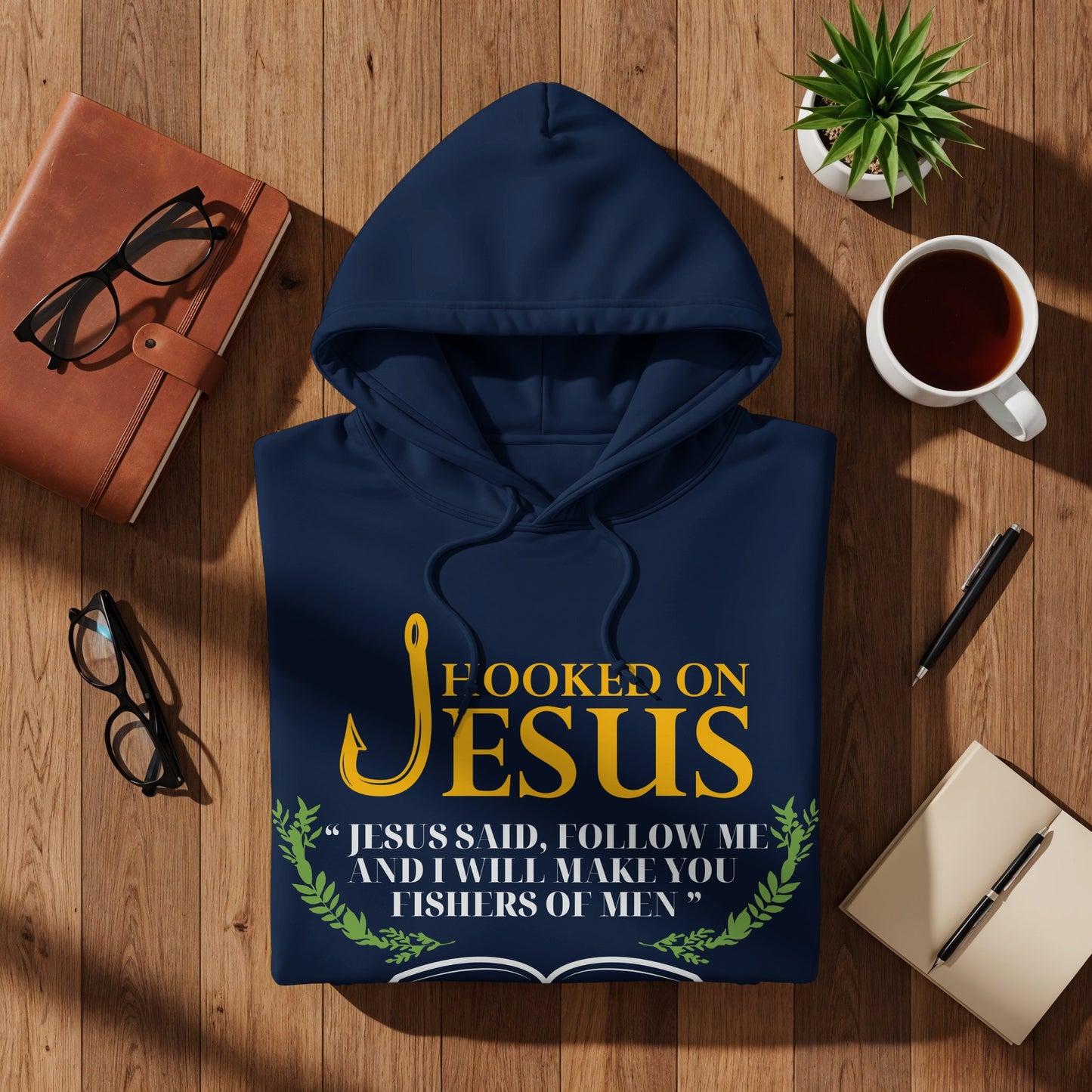 Navy hoodie with "Hooked on Jesus" text and Bible verse.
