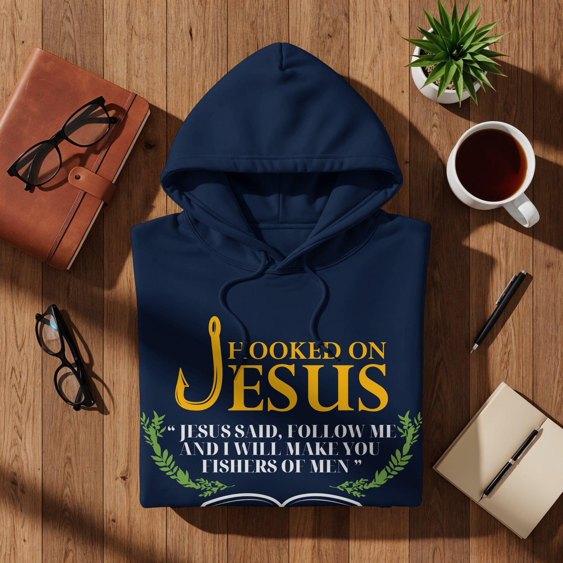 Navy hoodie with "Hooked on Jesus" text and Bible verse.