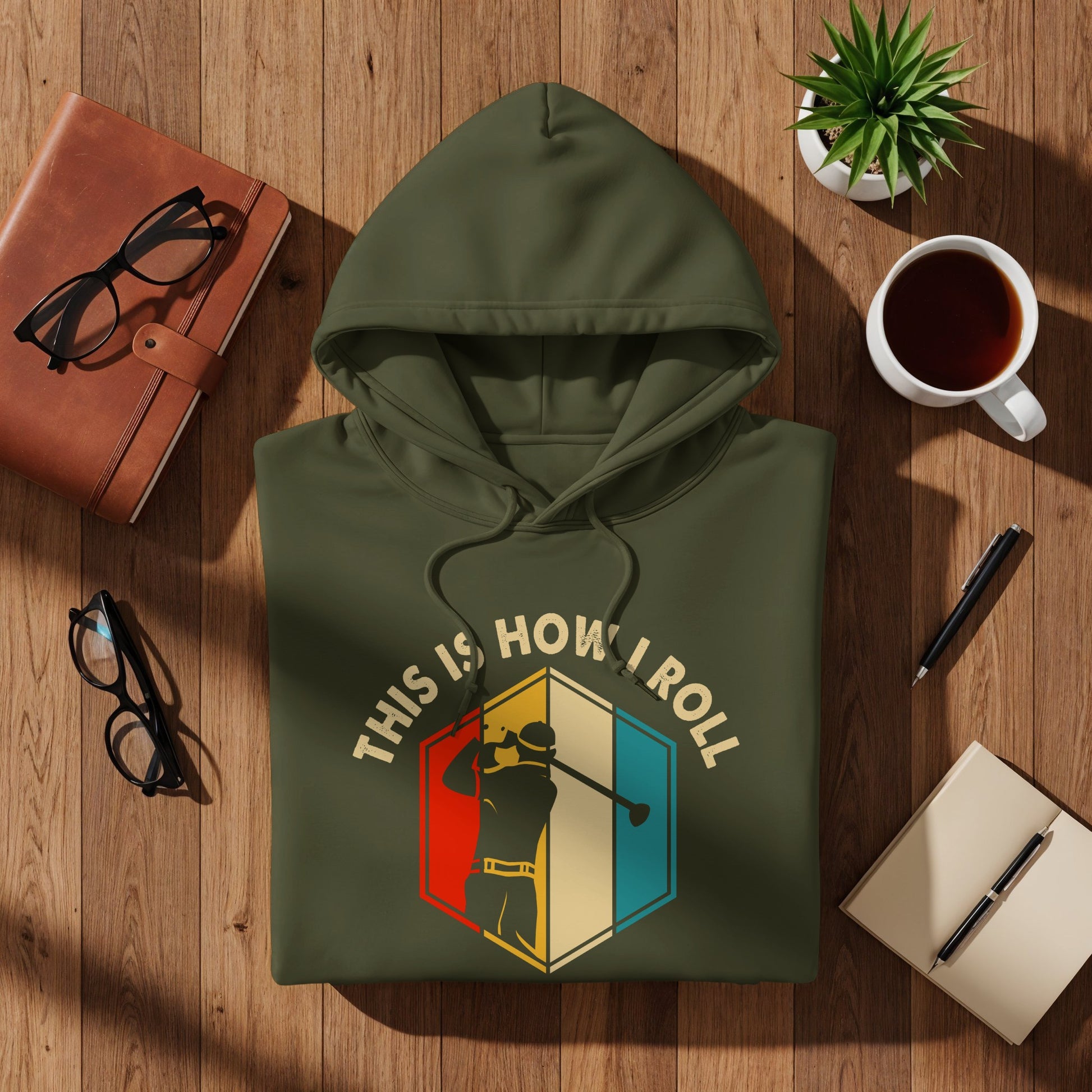 Olive green hoodie with "This is how I roll" text and a golfer graphic.