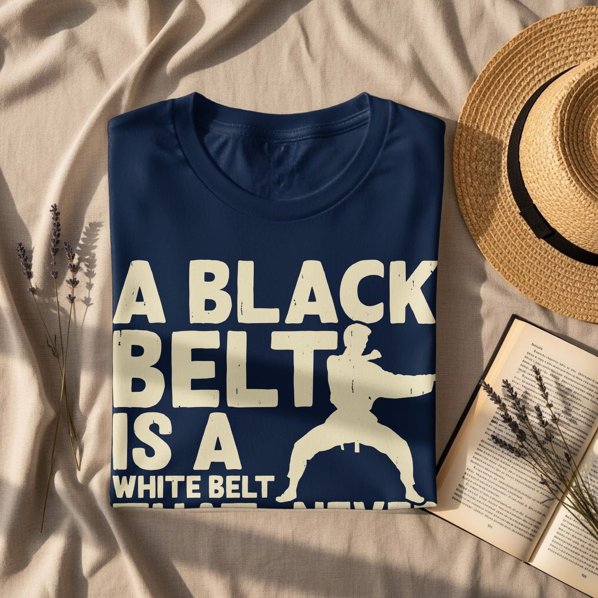 Navy t-shirt with "A BLACK BELT IS A WHITE BELT" and karate silhouette.