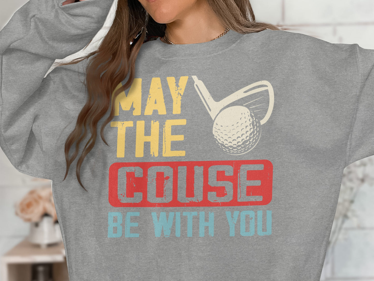 Grey sweatshirt with "MAY THE COUSE BE WITH YOU" and golf club graphic.