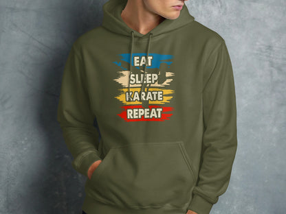 Green hoodie with "Eat Sleep Karate Repeat" text in distressed colorful lettering.