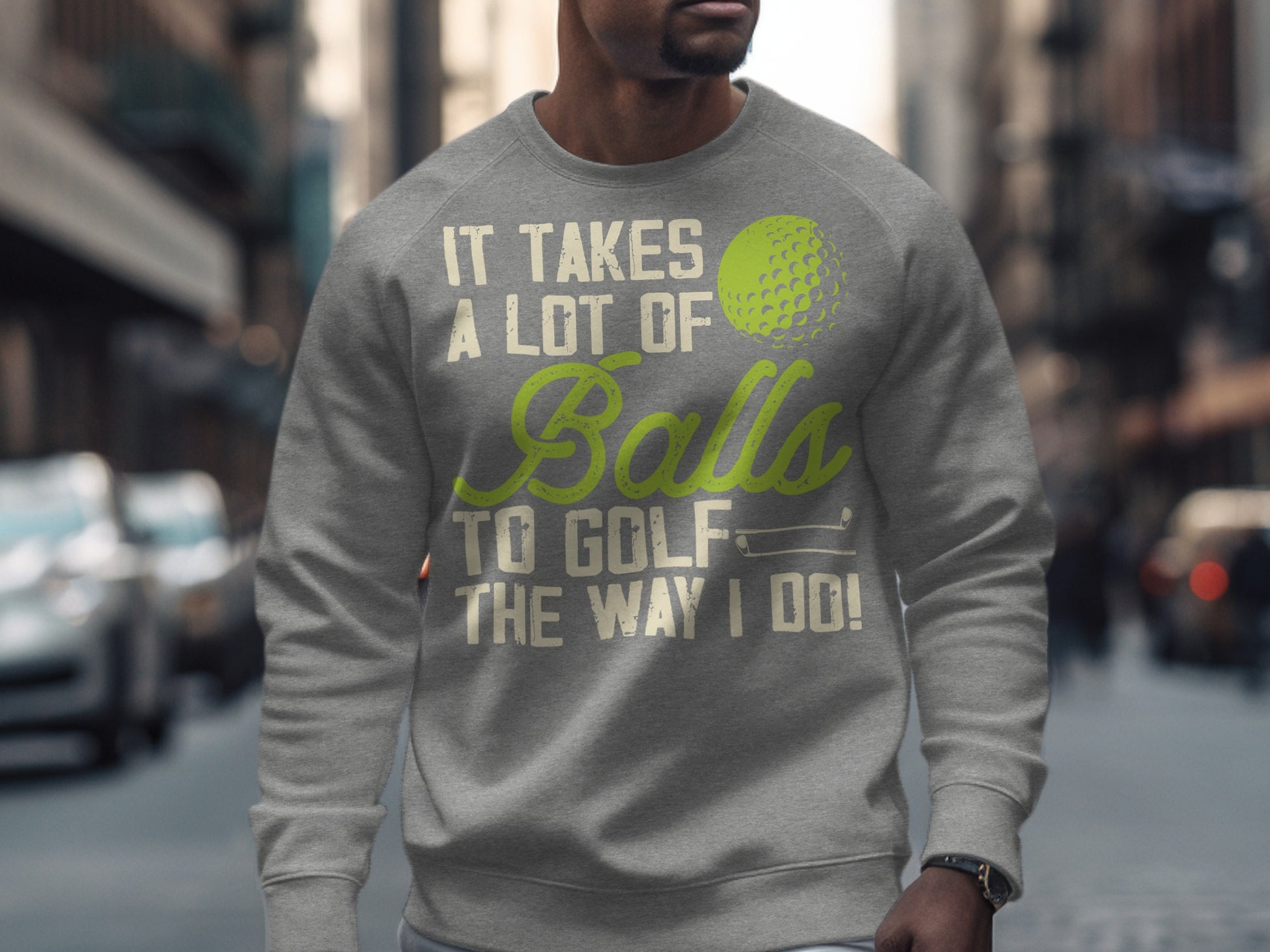 Gray sweatshirt with "It takes a lot of balls to golf the way I do!" text and golf ball graphic.