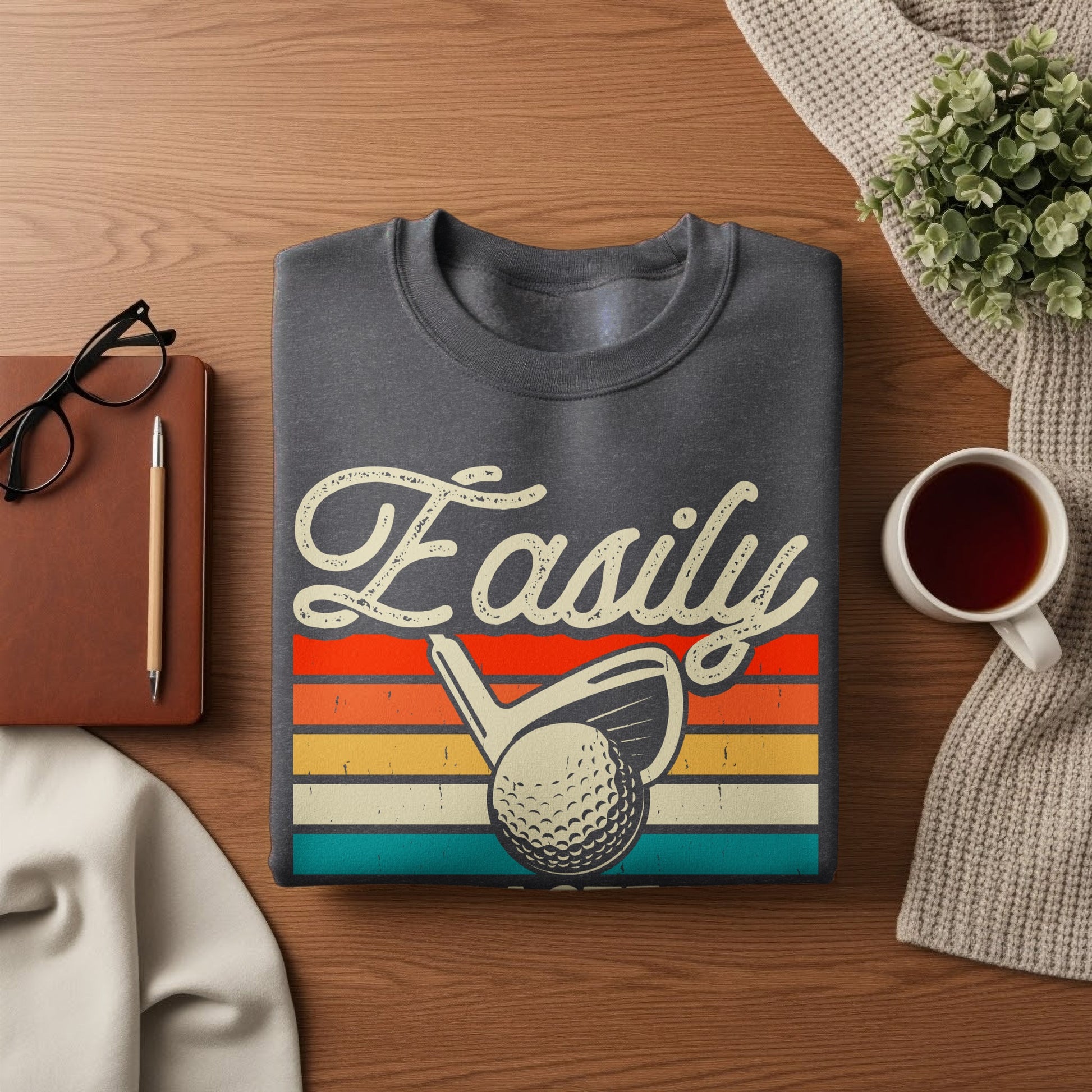 Gray sweatshirt with "Easily" text and golf club and ball graphic.