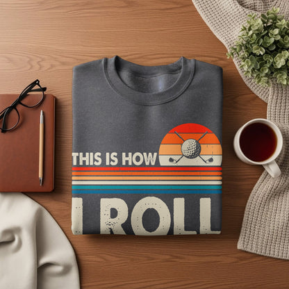Dark gray sweatshirt with "THIS IS HOW I ROLL" text and golf balls.