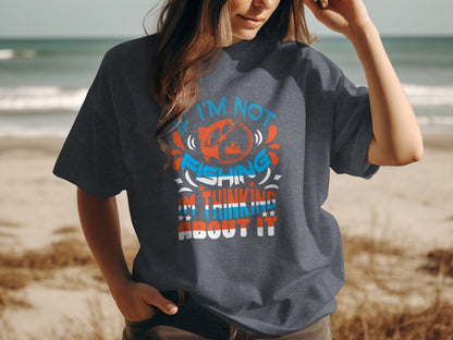 Dark t-shirt with "I'm not fishing, I'm thinking about it" graphic.