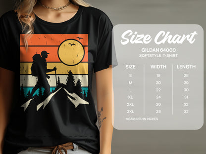 T-shirt with mountain graphic and size chart for Gildan 64000 softstyle t-shirt.