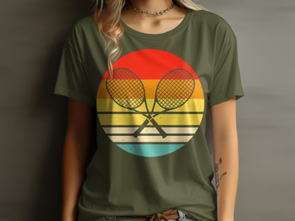 Green t-shirt with crossed tennis rackets on a retro sunset graphic.