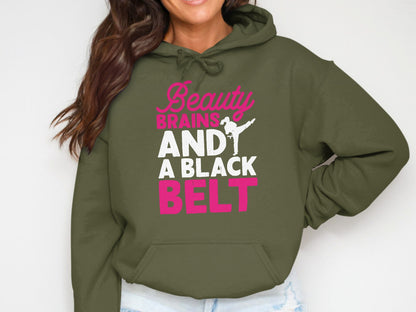 Olive green hoodie with "Beauty, Brains, AND A BLACK BELT" text and karate silhouette.