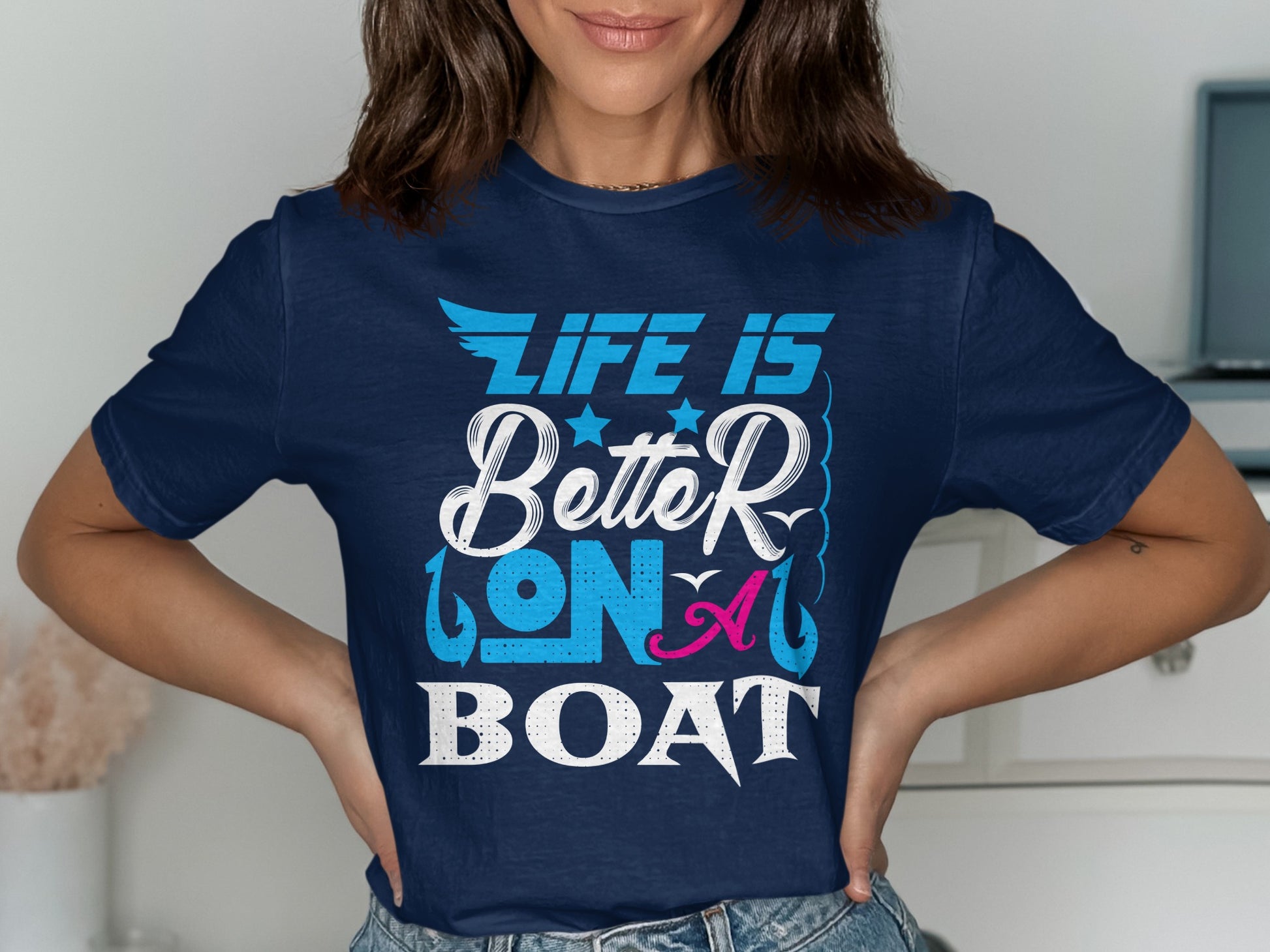 Navy t-shirt with "Life is Better on a Boat" text in white and pink.