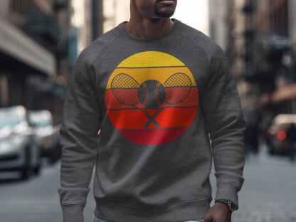 Men's grey sweatshirt with a circular tennis racket and ball graphic.