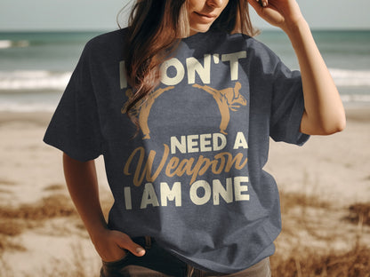 Dark blue t-shirt with "I DON'T NEED A WEAPON I AM ONE" and martial arts figures.
