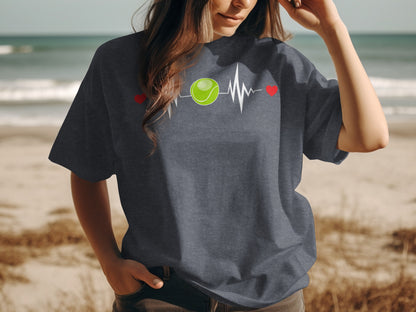 Dark t-shirt with a tennis ball heartbeat graphic and two red hearts.