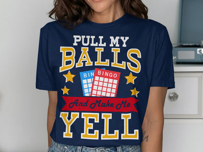 Navy t-shirt with "PULL MY BALLS AND MAKE ME YELL" text and bingo cards.