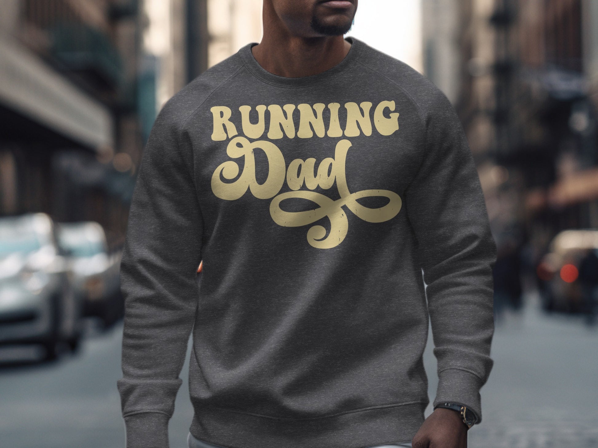 Man wearing a dark gray sweatshirt with "Running Dad" in yellow script.