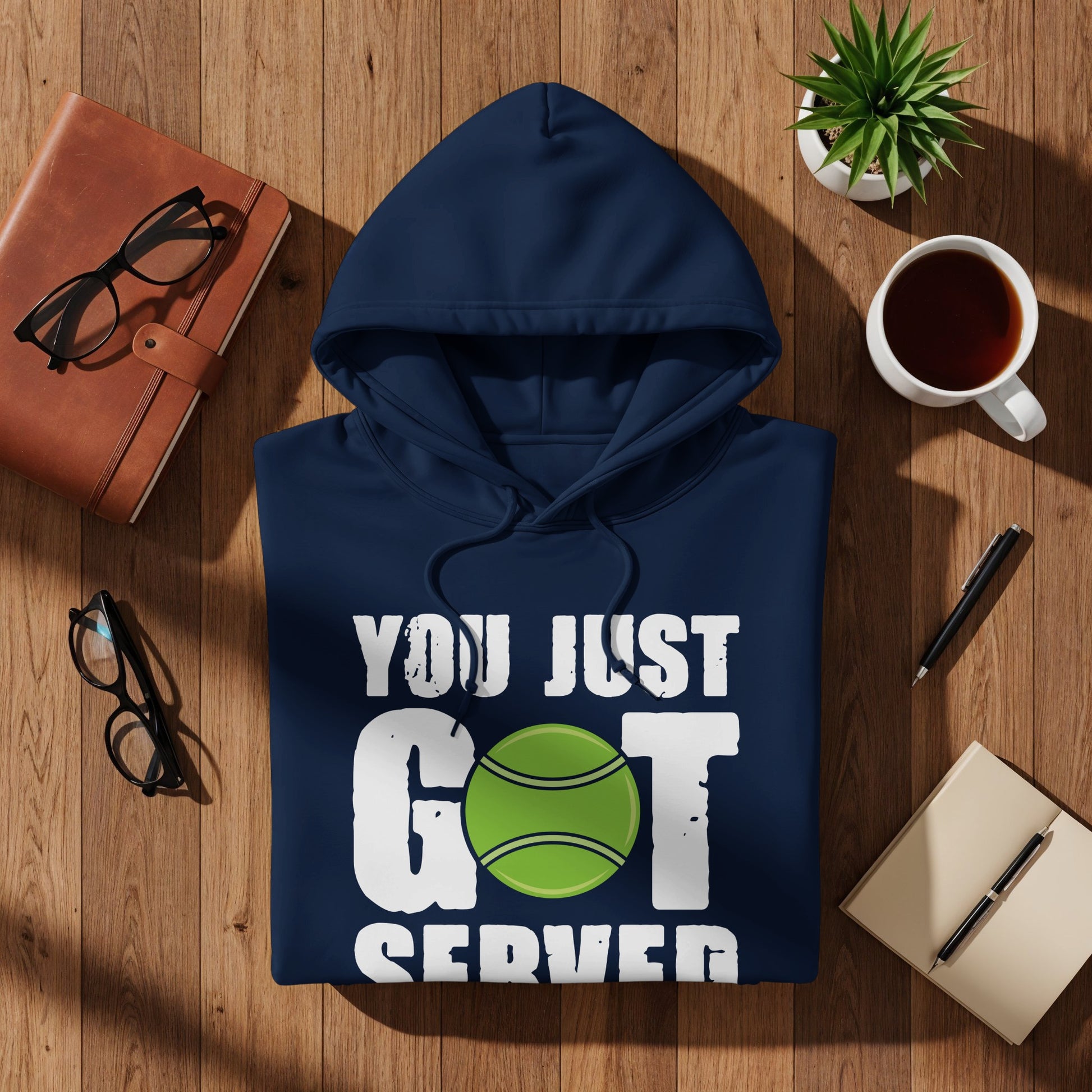Navy hoodie with "YOU JUST GOT SERVED" and tennis ball graphic.