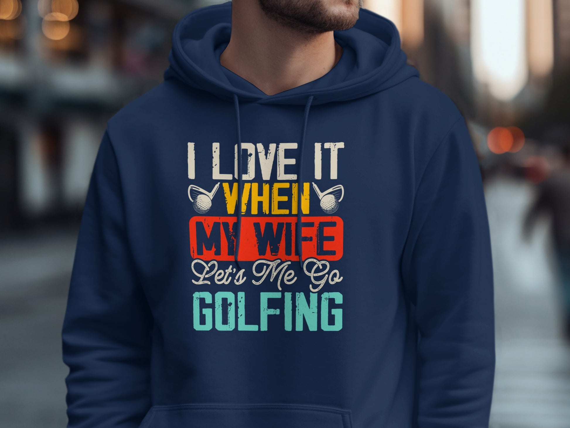 Navy hoodie with "I Love It When My Wife Lets Me Go Golfing" text.